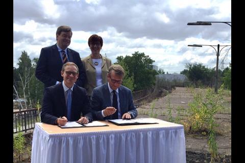 The funding agreement was signed on the platform of the disused Siemensstadt station.
